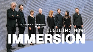 Eight smiling people in black concert dress standing in a row with the text “Lucilin Now! Immersion” superimposed on the photograph.